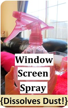 a bottle of window screen sprayer sitting on top of a pink blanket next to a black couch