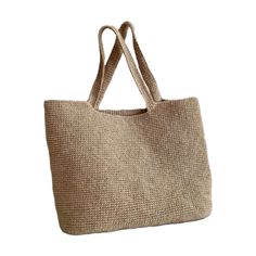 This is a beige beach bag with a robust and unique design. Notable for its sturdy construction, this bag is 100% handmade and crafted with raffia yarn, resulting in an excellent knit. The bag's spacious interior allows you to easily carry all your beach essentials. Its durable material makes it perfect for long-term use. Both stylish and functional, this bag is an ideal accessory to complement your look at the beach. Raffia Beige Jute Bags For Beach Season, Eco-friendly Lightweight Beige Shoulder Bag, Lightweight Beige Rectangular Beach Bag, Beige Handwoven Bag For Beach Season, Eco-friendly Neutral Shoulder Bag For Beach, Handwoven Beige Bag For Beach Season, Lightweight Beige Crochet Bag Rectangular, Eco-friendly Lightweight Natural Bag, Cream Jute Beach Bag For Daily Use