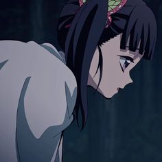 an anime character with black hair and red eyes