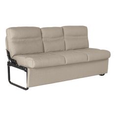 a beige couch sitting on top of a metal frame