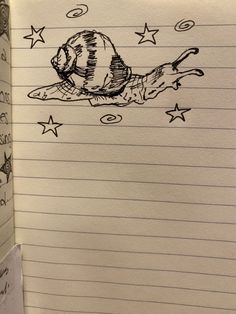 an open notebook with a drawing of a cat flying through the sky and stars on it