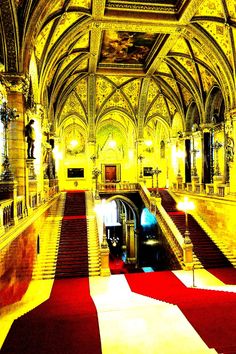 an ornate building with red carpet and gold walls