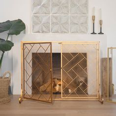 a living room with a fire place next to a potted plant