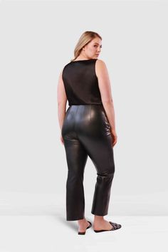 Slip into the polished Betta Vegan Leather Pant by Gabriella Rossetti. These must-have pants feature a stretch baby bell cropped leg and a sleek side zip closure, delivering a fabulously flattering fit. Perfect for both summer and winter, they offer a versatile edge that seamlessly transitions between seasons. Embrace the modern, playful sophistication that defines Gabriella Rossetti, and let the Betta Pant become your ultimate style staple. 45% polyurethane/45% viscose/7% cotton/3% metallic fib Chic Cropped Pants For Evening, Stretch Cropped Party Bottoms, Stretch Cropped Bottoms For Party, Stretch Cropped Pants For Workwear, Chic Cropped Bottoms For Night Out, Stretch Bottoms With Back Zipper For Night Out, Fitted Cropped Workwear Pants, Stretch Cropped Bottoms For Night Out, Stretch Cropped Pants For Night Out