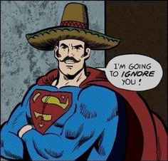 a man in a sombrero with his arms crossed, wearing a superman costume