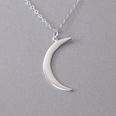 "Polished sterling silver crescent moon pendant necklace. Pendant (mm): 31 x 10 x 1 Chain: sterling silver flat cable chain available in 16\" and 18\" Also available in gold: https://www.etsy.com/listing/157765641/gold-crescent-moon-necklace Let's keep in touch, sign up for our newsletter and receive 15% off your first order https://lp.constantcontact.com/su/Dpyaymg" Dainty Fine Jewelry, Crescent Pendant, Crescent Moon Necklace Silver, Moon Necklace Silver, Crescent Moon Pendant, Moon Pendant Necklace, Pearl Jewelry Necklace, Diamond Solitaire Necklace, Crescent Moon Necklace