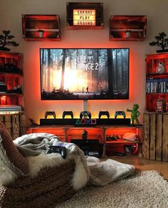 a living room filled with furniture and a flat screen tv mounted to the side of a wall