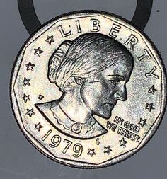 a coin with the image of a woman's head on it and stars around her neck