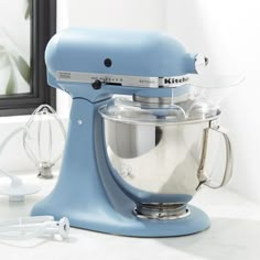 A matte finish gives this blue KitchenAid Artisan Series stand mixer a velvety look, adding a pop of personality and color to the kitchen. From mixing cake batter and whipping cream to kneading bread dough and shredding chicken, you'll find lots of uses for this classic, heavy-duty mixer that's built to last. The Artisan Series tilt-head stand mixer features ten-speed control with settings from very slow stirring to high-speed beating. Its five-quart stainless bowl with ergonomic handle accommod Walmart Kitchen, Kitchen Aid Appliances, Kitchen Design Pictures, Mixer Cover, Kitchenaid Artisan, Kitchenaid Stand Mixer, Head Stand, All White Kitchen, Blue Kitchen