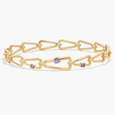 Colorful tanzanite and round diamonds shine in this 14k gold bracelet. A stunning piece that blends elegance with brilliance, this bangle is a unique addition to any jewelry collection. Pearl Jewelry Gift, Pearl Bracelet Gold, Platinum Rose Gold, Gold Rings Fashion, Gold Pearl Necklace, Gold Pearl Earrings, Ladies Diamond Rings, Ring Pendant Necklace, Rose Gold Jewelry