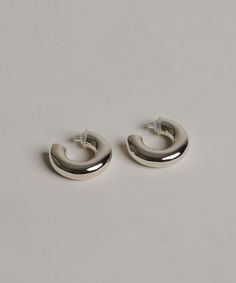 Small Donut Hoops SilverSophie Buhai is a designer living and working in Los Angeles. Her namesake jewelry collection, established in 2005, has renewed the modernist tradition of solid sterling silver with an emphasis on sculptural silhouettes. Sterling silver. Made in USA. Please note that this item is not eligible for promotions. | Sophie Buhai Small Donut Hoops Designer Living, Sophie Buhai, Cardigan Sweater Coat, Kids Sweater, Cool Socks, Long Sleeve Shirt Dress, Sunglasses Shop, Emphasis, Small Leather Goods