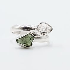 Divine Elegance Elevate your style with our exquisite Herkimer Diamond & Moldavite Ring, set in gleaming sterling silver. This stunning piece combines the celestial brilliance of Herkimer diamonds with the otherworldly energy of Moldavite, creating a ring that radiates elegance and power. Perfect for those who appreciate unique and spiritually significant jewelry, this ring is a true statement piece. Amplify Your Spiritual Journey Herkimer diamonds are renowned for their exceptional clarity and Moldavite Ring, Worry Stones, Herkimer Diamond, Tumbled Stones, Ring Sterling Silver, Spiritual Journey, Spiritual Growth, Stone Settings, Ring Set