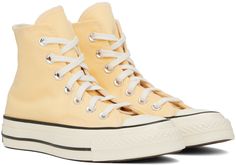 High-top canvas sneakers in yellow. Faux-leather logo patch at inner side. · Round rubber cap toe · Lace-up closure · Eyelets at inner side · Canvas lining · Padded OrthoLite® footbed · Textured rubber midsole · Treaded rubber outsole · Contrast stitching in white Supplier color: Sunny oasis/Egret/Black Yellow Casual Sneakers With Rubber Toe Cap, Casual Yellow Sneakers With Rubber Toe Cap, Yellow High-top Sneakers With Rubber Toe Cap, Yellow Canvas High-top Sneakers With Vulcanized Sole, Sporty Yellow Sneakers, Yellow Low-top Sneakers With Rubber Toe Cap, Yellow Canvas Lace-up High-top Sneakers, Yellow Lace-up Canvas High-top Sneakers, Yellow Converse High-top Sneakers With Rubber Sole