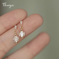 Elevate your style with Thaya's Sterling Silver Earrings, featuring gemstones and diamond accents. Crafted from high-quality 925 silver or 14k gold plated, these earrings are perfect for any woman who loves elegant and sophisticated jewelry. The diamonds add a touch of sparkle, while the inlay material of sterling silver and gemstones enhances their durability and beauty. With a weight of just 1.5g, these earrings are comfortable for everyday wear. The process of diamonds ensures their quality a Teardrop Bridal Earrings, Stud Earrings Women, Earrings Women, Party Jewelry, Gold Earrings Dangle, 925 Sterling Silver Earrings, Pretty Jewellery, Ear Jewelry, Bridal Earrings