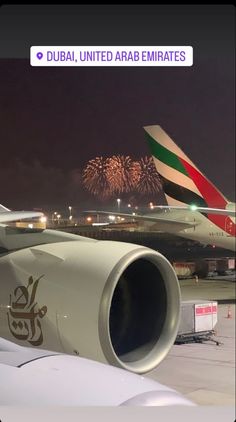 an airplane with fireworks in the background