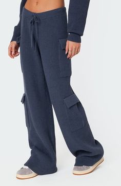 These high-rise sweater-pants feature cargo-style patch pockets and a relaxed profile ideal for off-duty days. Elastic/drawstring waist Cargo flap-patch pockets 50% polyester, 50% rayon Machine wash, dry flat Imported Blue Full-length Cargo Pants For Fall, Blue Full-length Cargo Jeans For Fall, Blue Cargo Jeans For Fall, Full Length Blue Cargo Jeans For Fall, Fall Blue Cargo Jeans, Blue Straight Leg Cargo Pants For Fall, Blue Cargo Pocket Bottoms For Fall, Blue Cargo Bottoms For Fall, Fall Blue Bottoms With Cargo Pockets