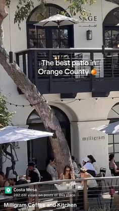 people sitting at tables under umbrellas in front of an orange county building with the words, the best patio in orange county