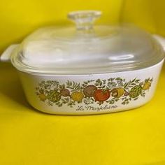 a white casserole dish on a yellow surface