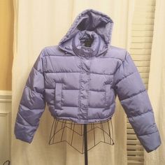 Brand New Never Worn Soho Apparel Crop Puffer Jacket In A Slate Blue Provides Warmth And Style. This Super Stylish Lightweight Jacket Has Zipper And Snap Closure, Side Pockets, Attached Hood, And Drawstring Toggles At The Waist And The Hood. Size M/L. Hooded Purple Puffer Jacket For Winter, Purple Hooded Puffer Jacket For Winter, Trendy Purple Hooded Outerwear, Purple Winter Outerwear, Casual Purple Puffer Jacket For Fall, Purple Puffer Jacket For Fall And Cold Weather, Hooded Purple Outerwear For Fall, Purple Hooded Outerwear For Spring, Purple Hooded Outerwear For Fall