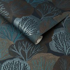 a wallpaper with blue and brown leaves on it's surface, showing the pattern