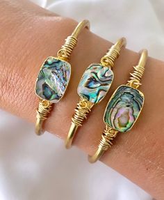 **Each piece in my shop, I personally create and photograph. (All photos are property of The Cord Gallery LLC) Thank you for supporting my small business. Genuine Abalone Shell Cuff Bracelet - Beachy Jewelry Add some color to your collection with these vibrant bracelets!  Features genuine Abalone Shells, framed in 22k gold plating and affixed to a raw brass cuff.  Each shell has stunning iridescent shades of blue, green, pink, and gold and will be totally unique as these are taken from nature to Luxury Oyster Bracelet Cuff As Gift, Luxury Abalone Shell Jewelry Gift, Bohemian Stackable Cuff Bracelet As Gift, Bohemian Stackable Cuff Bracelet Gift, Elegant Stackable Beach Jewelry, Unique Stackable Cuff Bracelet As Gift, Unique Stackable Cuff Bracelet For Gifts, Unique Stackable Cuff Bracelet Gift, Elegant Handmade Bracelets For Vacation