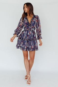 Shop the Laney Cutout Back Ruffle Detail Floral Dress Navy | Selfie Leslie Fitted V-neck Tiered Dress With Ruffle Hem, Chiffon Tiered Mini Dress With Ruffle Hem, Chiffon Mini Dress With Ruffles And Long Sleeves, Long Sleeve Chiffon Mini Dress With Ruffles, Flowy Ruffle Hem Dress For Garden Party, Chiffon Mini Dress With Ruffle Hem For Garden Party, Fitted Tiered Puff Sleeve Dress With Ruffles, Lantern Sleeve Dress With Ruffle Hem For Brunch, Chiffon Mini Ruffle Dress With Ruffle Hem