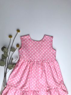 adorable, pink, polka dotted print. 100 % cotton, handpicked material. Handmade dress and bonnet at home. You can buy this set together or just the bonnet or just the dress. Playful Cotton Dresses For Daywear, Playful Polka Dot Fitted Dress, Cute Swiss Dot Cotton Dress, Cute Cotton Swiss Dot Dresses, Fitted Pink Swiss Dot Dress, Cute Polka Dot Cotton Dress, Pink Polka Dot Dress, Pink Floral Dress, Girls Clothing Sets