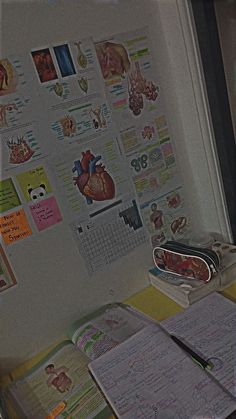 a white refrigerator freezer sitting inside of a kitchen next to a wall covered in magnets