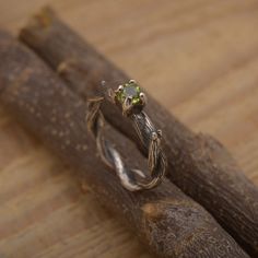 Sterling silver twisted branch ring with natural peridot / amethyst / garnet/ blue or white topaz gemstone 4mm. Birthstone nature inspired engagement ring. Tree bark women's ring. Unique artistic anniverary, promise or anniversary ring.  An exceptional sterling silver tree branch ring with a natural gemstone, custom handmade in fine artisan detail. This nature inspired branch ring is also ideal for the woman who loves nature and prefers a non-traditional engagement or anniversary ring. We offer free standard shipping worldwide. Orders are dispatched by recorded post. All our pieces are handmade and made to order, orders are fulfilled within 4 -10 working days. Your order will be carefully packaged in a beautiful giftbox and shipped in a bubble mailer, ready for the big moment! ♥ We offer a Tree Branch Ring, Branch Engagement Ring, Traditional Engagement, Ring Tree, Beautiful Wedding Bands, Nature Inspired Engagement Ring, Twig Ring, Branch Ring, Silver Tree