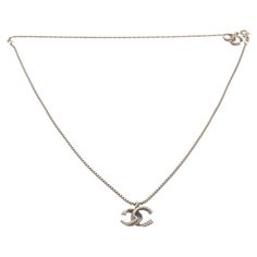 Chanel silver CC chain necklace features a silver-finished body, lobster claw closure with the Chanel stamp on it, a CC logo with rhinestones on it at the end of the chain, and a CC twist logo pendant with rhinestones on it. 57905MSC Twist Logo, Chanel Vintage, Cc Logo, Coco Chanel, Lobster Claw, Karl Lagerfeld, Chains Necklace, The End, Chain Necklace