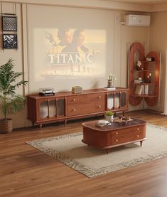 a living room with wooden furniture and a large poster on the wall above it's entertainment center