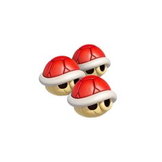 two red and white christmas hats on top of each other in front of a white background