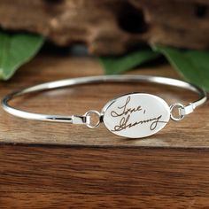 Actual Handwriting Bangle Bracelet, Memorial Bracelet, Sympathy Gift, Personalized Engraved Bracelet, Gift for Her, Signature Bracelet This laser engraved Stainless Steel bangle bracelet is a perfect gift for your Mom, Best Friend or Bride or Bridesmaids! or anyone you choose! Personalized with actual handwriting. This is engraved into high quality heavy gauge stainless steel. Engravable Portion: 15mm x 24mm Stainless Steel does NOT tarnish. How to order: 1. Add this item to your shopping cart 2 Meaningful Adjustable Jewelry With Engraving Option, Adjustable Meaningful Jewelry With Engraving Option, Engraved Bangle Bracelets For Gifts, Engraved Adjustable Bangle Name Bracelet, Engraved Charm Bracelet For Friendship, Adjustable Engraved Meaningful Bracelet, Adjustable Engraved Meaningful Bracelets, Meaningful Engraved Adjustable Bracelet, Personalized Spiritual Bangle Bracelet