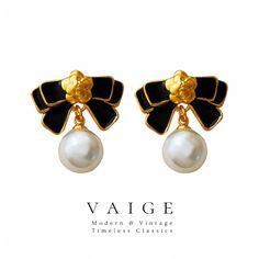 VAIGE Black Enamel Bowknot Dangle Round Pearl Gold Earrings 925 Sterling Elevate your accessory game with the exquisite VAIGE Black Enamel Bowknot Dangle Round Pearl Gold Earrings. Crafted from premium 925 sterling silver, these earrings are not just an accessory; they are a statement of elegance and sophistication. Featuring: Stunning Black Enamel: The chic bowknot design adds a touch of modernity and flair. Round Gold Pearls: These pearls provide a luxurious contrast that catches the light bea Elegant Black Enamel Earrings For Gift, Pearl Gold Earrings, Gold Pearl Earrings, Stylish Earring, Silver Drop Earrings, Glass Earrings, Pearl Drop Earrings, Gold Pearl, Pearl Drop