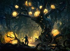 a man standing in the middle of a forest next to a tree with lanterns on it