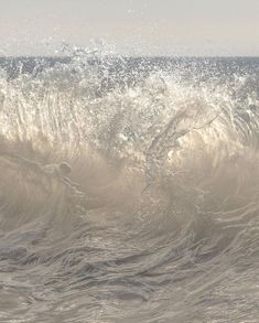 a person riding a wave on top of a surfboard