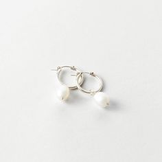 A classic hoop with a statement pearl. Dress them up or down. Everyday White Gold Earrings With Pearl Drop, Everyday White Gold Pearl Drop Earrings, Everyday White Pearl Pendant Earrings, Timeless White Hoop Earrings For Wedding, Small Hoop Pearl Earrings For Everyday, Small Pearl Hoop Earrings For Everyday, Everyday Small Hoop Pearl Earrings, Everyday Small Pearl Hoop Earrings, Everyday White Pearl Drop Earrings