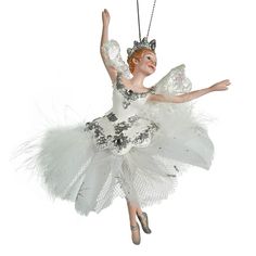 a white ballerina ornament hanging from a chain