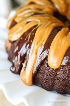 a chocolate bundt cake with caramel drizzle on top