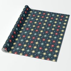 a blue wrapping paper with colorful stars on it