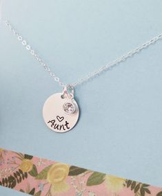 "Please make sure you don't forget to put the information for personalization in the note to seller box at check out :) This necklace has one 5/8\" sterling silver disc and up to 7 cz Sterling silver 4mm birthstones. Necklace comes with a 20, 18, or 16\" sterling silver cable chain Please provide the following at checkout in message to seller box: -Name you want stamped -Birthstones - Please see forth photo for birthstone colors Each letter has been individually hand stamped. Because of this, th Silver Birthstone Necklace With Round Shape For Personalized Gift, Silver Birthstone Necklace For Birthday With Round Pendant, Adjustable Silver Birthstone Necklace For Anniversary, Personalized Silver Jewelry With Round Stone, Mother's Day Round Birthstone Necklace, Engraved Silver Round Birthstone Necklace, Nickel Free Round Charm Necklaces For Birthday, Nickel-free Round Charm Necklaces For Birthday, Stamped Round Charm Necklace For Mom