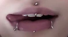 a woman with piercings on her lips