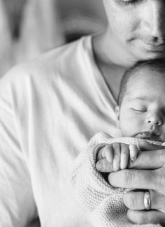 a woman holding a baby in her arms