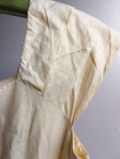 "1950s handmade sun dress yellow cotton w/very subtle leaf motif print sleeveless pullover wide pleated shoulder straps square neck/back fitted top w/breast darts side zipper pleated waist good vintage condition, light wear light rust color stains here and there measures, lying flat, shoulder-20\" bust-18 3/4\" (37 1/2\" total) waist-14\" (28\" total) top shoulder to waist-16 1/2\" total length-44\"" Retro Summer Top With Square Neck, Summer Cotton Tops With Fitted Bodice, Summer Cotton Top With Fitted Bodice, Fitted Summer Top With Gathered Sleeves, Summer Tops With Fitted Bodice And Square Neck, Fitted Cotton Tops With Smocked Back, Fitted Lined Casual Tops, Retro Square Neck Top For Spring, Vintage Square Neck Tops For Spring