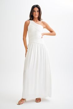 Best DressedThe JENNA One Shoulder Pleated Maxi Dress is a stunning and elegant choice for any special occasion. Featuring a chic one-shoulder design and an asymmetrical waistline, this dress beautifully accentuates your silhouette. The pleat detailing on the bodice adds a touch of sophistication, while the full gathered skirt flows gracefully to a maxi length. With a side zip for easy wear and a fully lined interior for comfort, the Jenna dress ensures you look effortlessly glamorous. Full Gathered Skirt, European Summer Outfits, Capsule Outfits, Pleated Maxi Dress, Pleated Maxi, Gathered Skirt, Crepe Dress, Shoulder Design, Spring Dresses