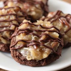 chocolate cookies with caramel toppings on a white plate