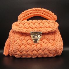 Luxury Crochet Bag - Capri Knit Orange Shoulder Bag - Handmade Boho Designer Tote, Elegant Artisanal Crossbody Bag Introducing our luxurious Capri Knit Orange Crochet Bag, a perfect blend of elegance and practicality. This handmade boho shoulder bag is meticulously crafted to bring a unique touch of sophistication to your style. Its vibrant orange color and intricate knit pattern make it an eye-catching accessory for any occasion, whether it's a casual outing or a special event. Features: Materi Handmade Orange Top Handle Shoulder Bag, Orange Handmade Top Handle Shoulder Bag, Handmade Orange Crochet Bag, Handmade Orange Rectangular Crochet Bag, Handmade Orange Crochet Bag For Daily Use, Handmade Orange Satchel Bag, Handmade Handheld Orange Shoulder Bag, Handmade Orange Handheld Shoulder Bag, Orange Crochet Rectangular Bag