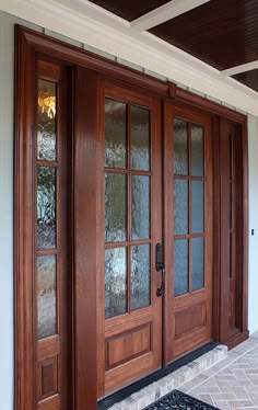 the front door of a house with two glass doors