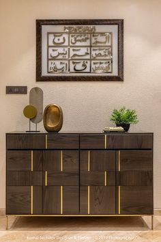 a large wooden cabinet sitting next to a potted plant on top of a table