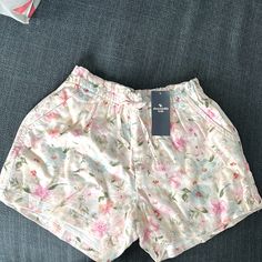 White With Flowers Front Tie Adjustable Spring Playwear Summer Style Bottoms, Summer Style Bottoms For Spring Playwear, Spring Short Bottoms For Playwear, Spring Playwear Bottoms In Short Length, Short Spring Playwear Bottoms, Relaxed Fit Shorts For Playwear, Spring Season, Relaxed Fit Shorts For Spring Playwear, Casual Playwear Bottoms For Summer, Casual Summer Playwear Bottoms